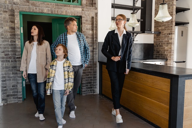 family-and-landlord-doing-a-walkthrough-of-a-rental-property